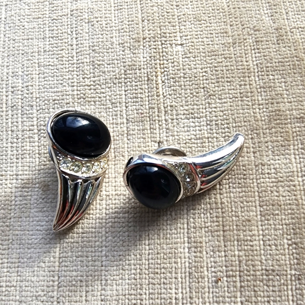 Studs, costume jewelry. Looks like talons